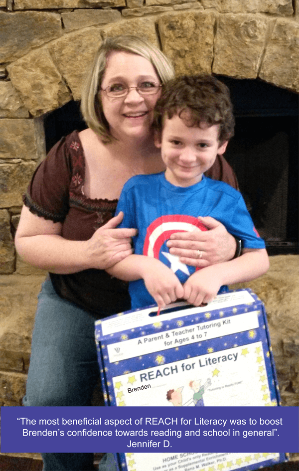 A woman and boy holding a box of books.